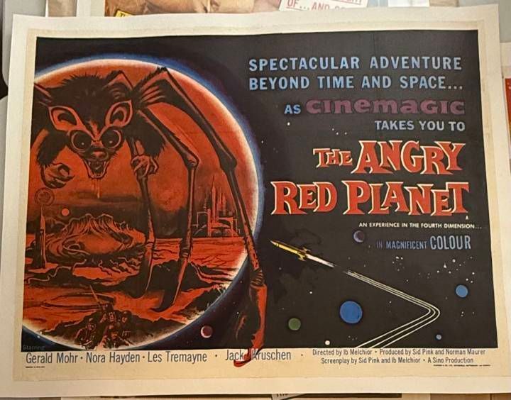 Vintage-style movie poster for 'The Angry Red Planet' with space-themed design.